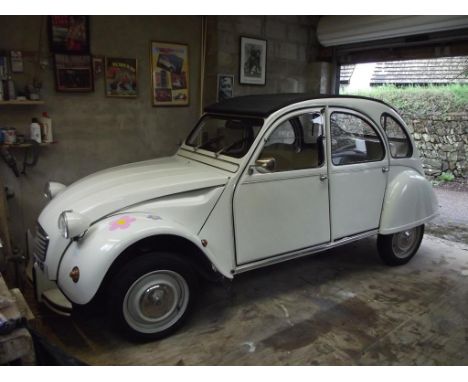 A 1977 Citroen 2CV, registration number TLC 894R, white. TLC 894R has been the subject of a full restoration over a period of