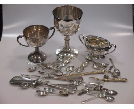 A silver presentation engraved trowel, two silver trophies, together with a silver sugar bowl, some silver cutlery and flatwa