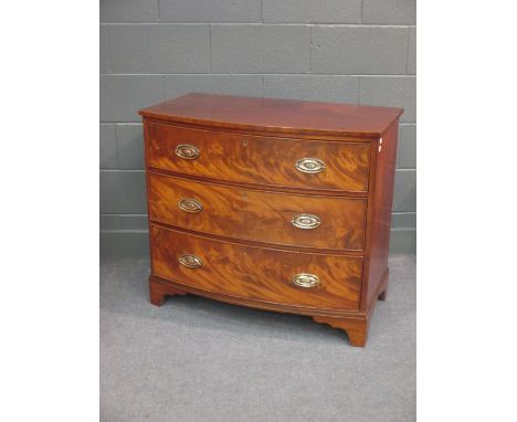 An early 19th century mahogany bow fronted chest of drawers on bracket feet 83 x 94 x 53cm  