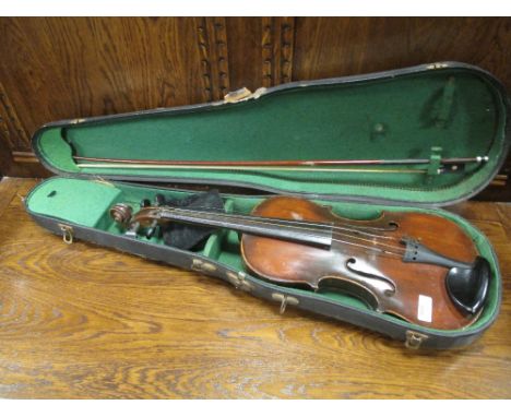 A German violin with Stradivarius label (full size) cased  Signs of repair and damage