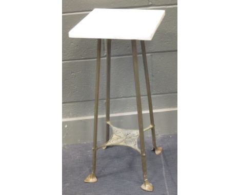 An Art Nouveau brass stand with marble top  
