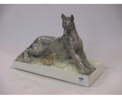 A Continental Goldscheider style model of a dog &amp; a lizard  