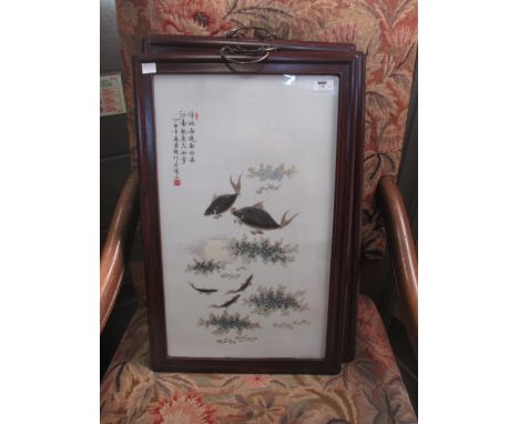 A set of four Chinese early 20th century large framed ceramic plaques, decorated with fish, 62 x 38.5 cm  