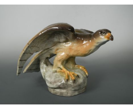 A large Goldscheider model of an eagle by Vácslav Suchanek, naturalistically painted and modelled atop a rocky base, impresse