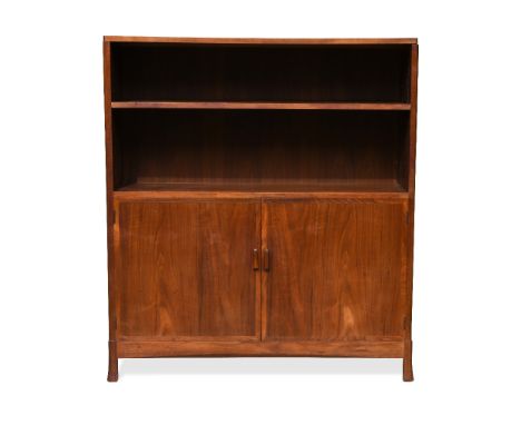 A Cotswold School walnut cabinet, the rectangular top with re-entrant corners above single adjustable open shelf over a pair 