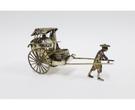 Luen-Wu, Shanghai, a Chinese silver rickshaw with cruets, stamped marks to base, 19cm long 