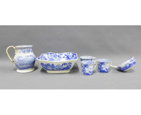 A collection of Staffordshire blue and white transfer printed pottery to include treacle jug (a/f) Spode ladle and three mugs