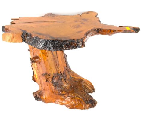 A small high lacquered coffee table of naturalistic form, featuring a tree trunk slice top, height 41cm, length 69cm.