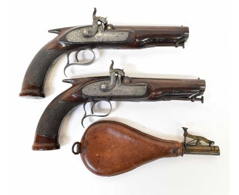 A pair of 19th century twenty bore percussion cap pistols, with 5" barrels, intricate foliate sprays engraved to the locks, w