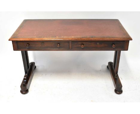 A Victorian rosewood side table/desk with leather insert top, two frieze drawers above stile supports with fretwork inlay and