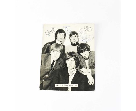 ROLLING STONES; a black and white promotional photograph multi-signed front and verso, Mick Jagger, Bill Wyman, Charlie 'Boy'