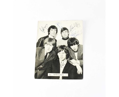 ROLLING STONES; a black and white promotional photograph multi-signed front and verso, Mick Jagger, Bill Wyman, Charlie 'Boy'