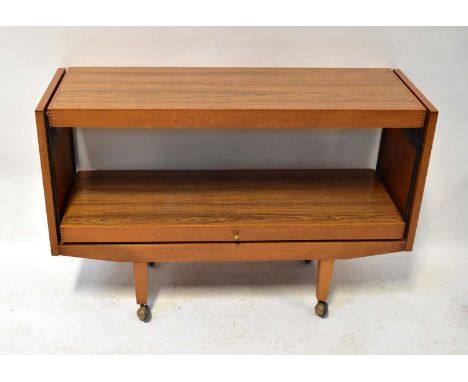 A mid-20th century metamorphic sideboard/table, on square tapering legs with castors, 76 x 114 x 38cm.