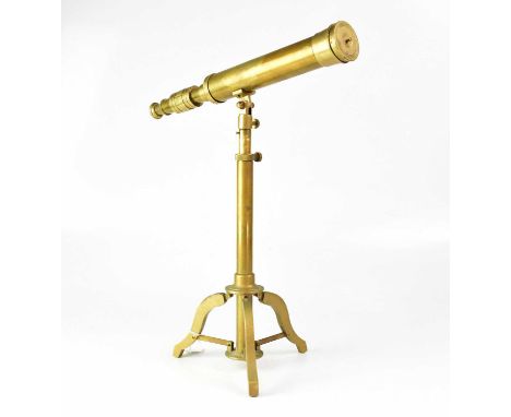 A brass telescope on an adjustable telescopic stand with tripod base, height 47cm.Condition Report: When looking through this