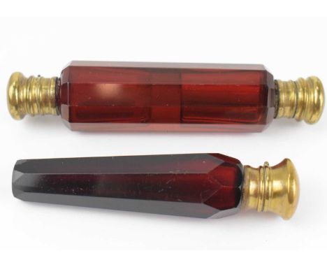 Two 19th century ruby cut glass perfume decanters, comprising one of tapered form with brass cap, length 10cm, the other doub