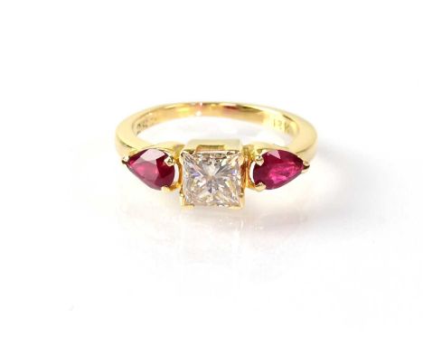 An 18ct yellow gold ring set with central square cut diamond, approx 0.8ct, with ruby to each shoulder in claw settings, size