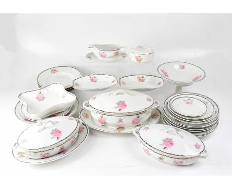 An F. K. Kaestner porcelain part dinner service, comprising covered tureens, meat plates, sauce boat, various plates, bowls, 