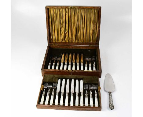 An oak cased dessert knife and fork set for twelve place settings, with mother of pearl style handles and hallmarked silver c