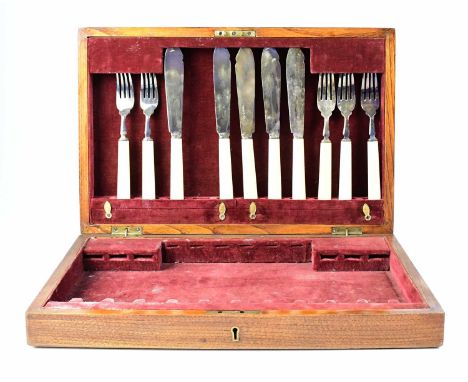 GOLDSMITHS &amp; SILVERSMITHS COMPANY LTD; an oak cased part canteen of silver plated cutlery, with hinged lid above two draw