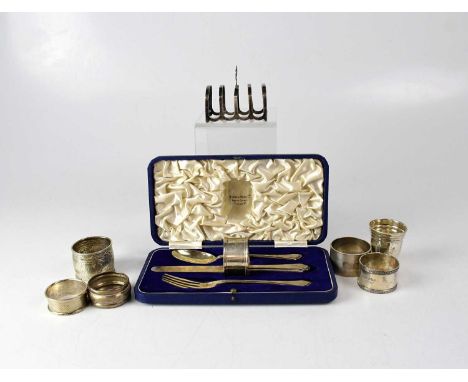 A cased George VI hallmarked silver child's set of fork, knife, spoon and napkin ring, engraved 'Meryl', Mappin &amp; Webb, S