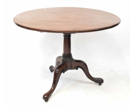 A George III mahogany circular tilt-top breakfast table, on a turned column and tripod cabriole base, height 74cm, diameter 9