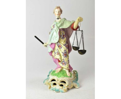 CHELSEA DERBY; a c.1770 figure of 'Justice' modelled holding a metal sword and a pair of scales, on a Rococo-style base, heig