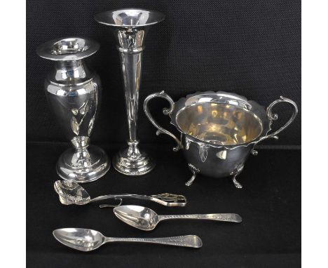 Six items of hallmarked silver, comprising a trumpet vase, height 16cm, an urn-shaped vase, height 14cm, both with loaded bas