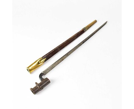 A Martini Henry .577/450 socket bayonet with brass bound leather scabbard, length of the tri-blade 43.5cm, overall length 52.