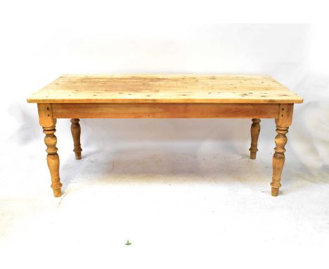 A pine kitchen table with rectangular top and single drawer, on baluster turned legs, 77 x 183 x 93cm.