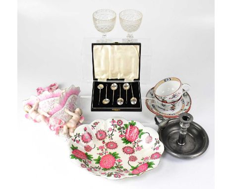 A collectors' lot comprising a cased set of six hallmarked silver coffee bean spoons, a pair of 19th century cups and saucers