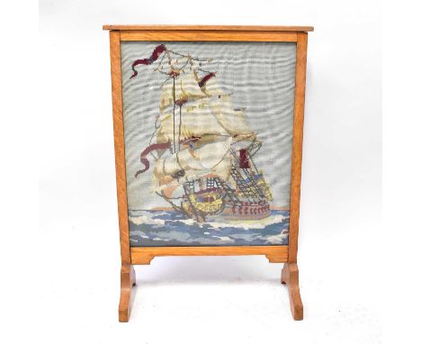 A mid-20th century oak framed and glazed fire screen with tapestry insert depicting a tall-masted ship, height 75cm.