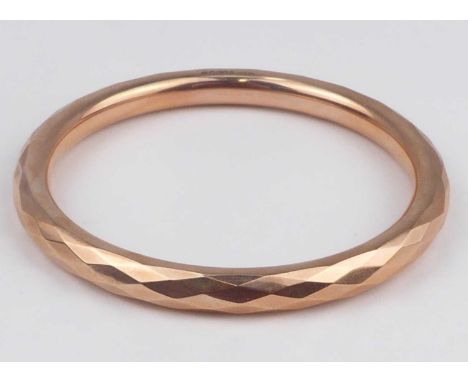 A Victorian 9ct rose gold hollow continuous bangle with diamond pattern decoration, internal diameter approx. 7.9cm, total di