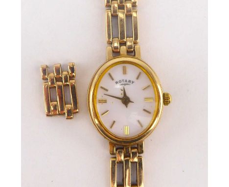 ROTARY; a ladies' 9ct gold wristwatch, the oval white dial set with baton numerals, quartz movement, in a 9ct gold case, with