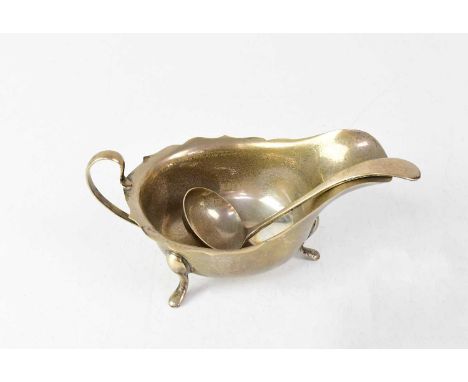 VINERS LTD; an Elizabeth II hallmarked silver sauce boat and ladle, sauce boat Sheffield 1960, the ladle Sheffield 1959, comb