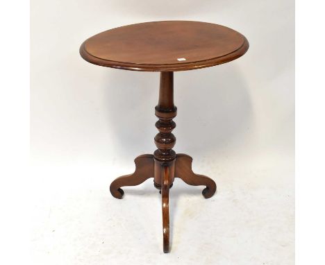 A Victorian mahogany oval-topped occasional table on turned column and tripod base, 71 x 60 x 43cm.