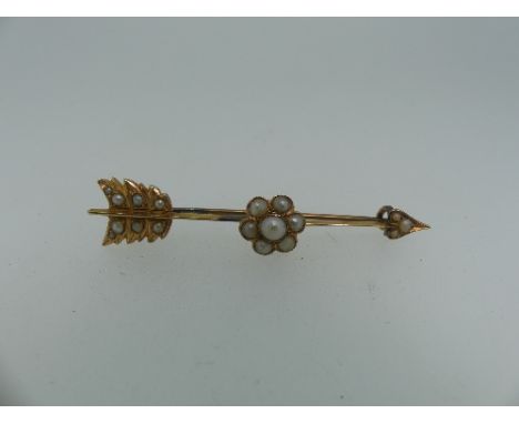 A 15ct yellow gold star burst shaped Pendant / Brooch, set seed pearls, one missing, 3.5cm diameter, together with a yellow m