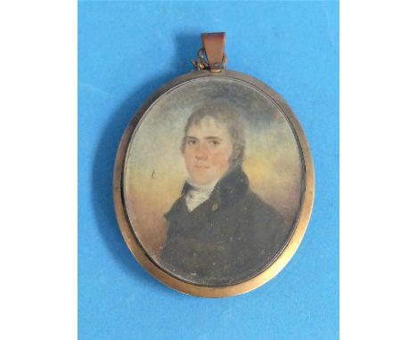 Early 19th century School, a miniature portrait of a young woman, oval, watercolour, in a gilt metal frame with hair plait re