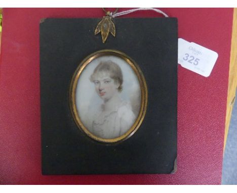 Early 19th century School, a portrait miniature of Martha Davis, oval, watercolour, in papier-mâché frame with gilt-metal mou
