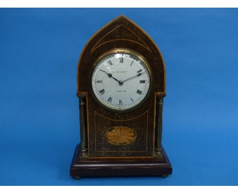 An Edwardian mahogany Mantel Clock, of pointed arch form with gilt-metal columns, boxwood stringing and marquetry inlay, the 