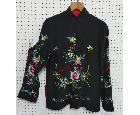 Chinese textiles: an embroidered black/red silk reversible Mandarin Jacket, the black silk exterior embroidered with Chrysant