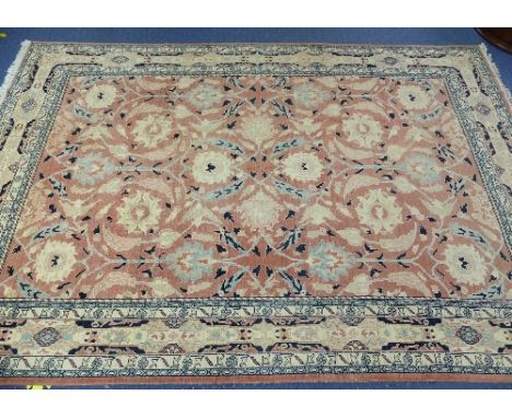 Tribal Rugs; a large hand knotted Bakshaish style rug, the light coral-coloured ground with large stylised patterns in cream,
