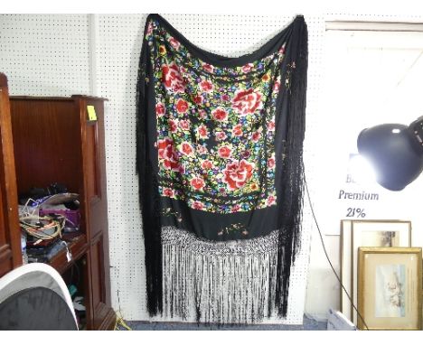 Chinese textiles: an early 20thC Chinese silk large embroidered Piano Shawl, the black ground profusely adorned in brightly c