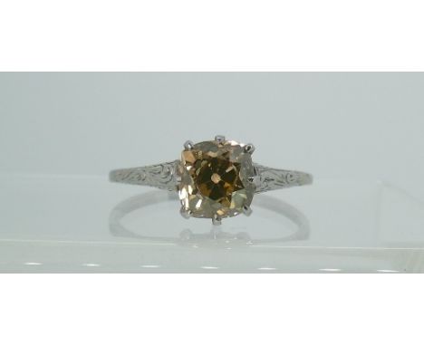 A yellow diamond solitaire Ring, of light yellow / orange tones, the Old Mined Cut stone circa 1½ct, all mounted in unmarked 