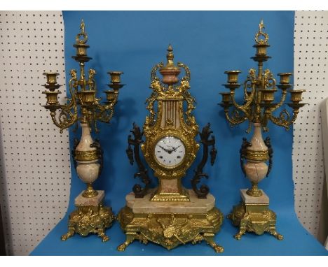 An Italian 19th century style three-piece "Imperial" Clock Garniture, the elaborate gilt-metal mounted marble clock on an ovo