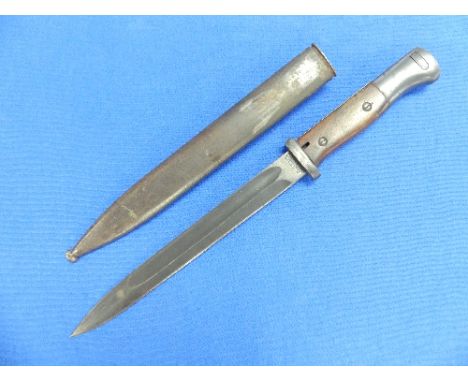 A German W.W.1 period 1920 Bayonet, and scabbard, the 9?in (25cm) blade signed Gottlieb Hammesfahr Solingen, Foche.