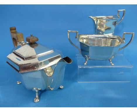 An Edward VIII silver three piece Tea Set, by Viner's Ltd., hallmarked Sheffield, 1936, of octagonal form with paw feet, the 