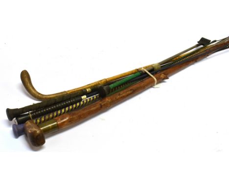 SEVEN ASSORTED RIDING CROPS  and a walking stick (8)