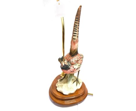 A CAPODIMONTE COCK PHEASANT FIGURE TABLE LAMP  mounted on a shaped wooden base, height of lamp 47cms and with shade