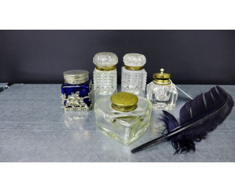 A collection of glass inkwells to include a heart shaped well and feather, blue glass and Epns mounted inkwell, a pair of hob