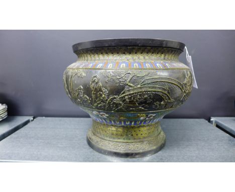 Cloisonné and patinated metal circular planter, the body with a frieze in relief depicting figures on horseback, 31cm diamete